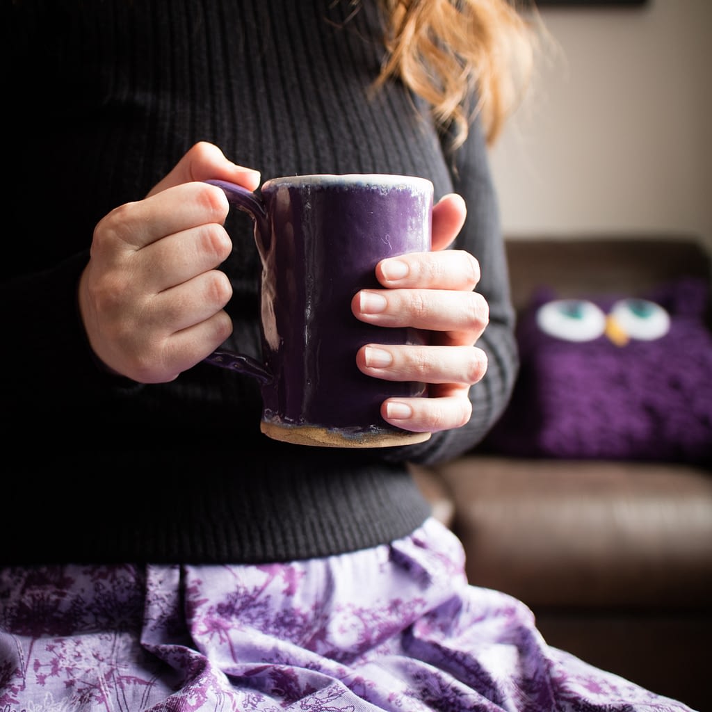Catherine Tuckwell Personal Brand Photography with handmade mug and purple crochet owl blanket